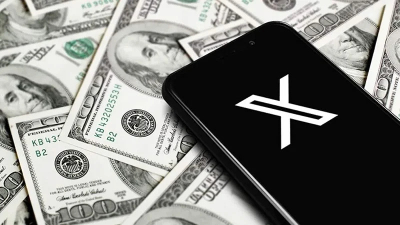 Smartphone displaying the X logo on U.S. dollar bills, illustrating X Money digital banking services nationwide.