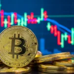 Golden Bitcoin coins stacked in front of a blue candlestick trading chart showing price movement