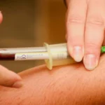 Blood sample collected from a patient's arm for early Alzheimer's disease screening and research testing