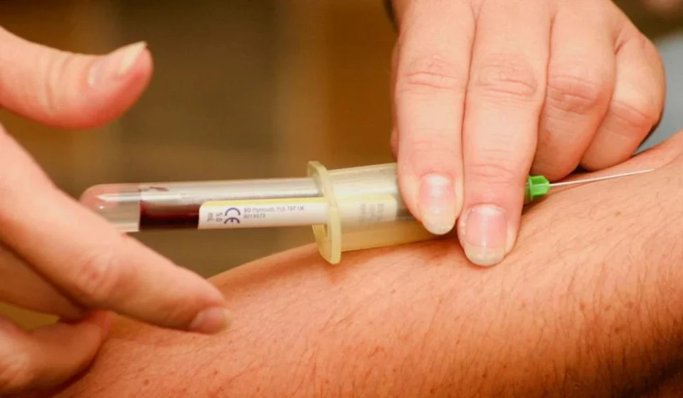 Blood sample collected from a patient's arm for early Alzheimer's disease screening and research testing