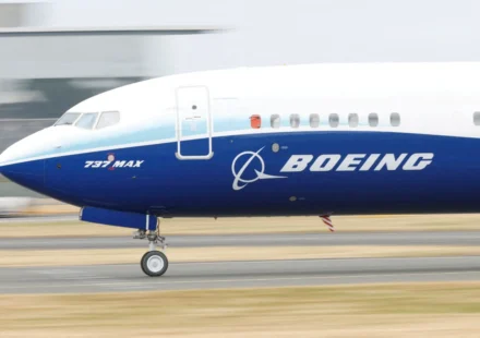 Boeing 737 MAX aircraft taxiing on a runway ahead of aerospace technology showcase at Farnborough Expo.