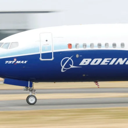 Boeing 737 MAX aircraft taxiing on a runway ahead of aerospace technology showcase at Farnborough Expo.