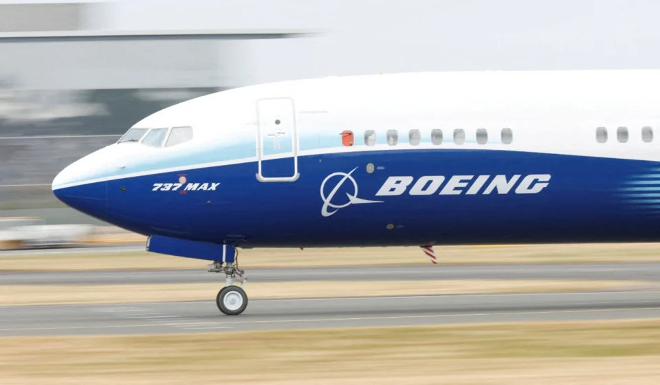 Boeing 737 MAX aircraft taxiing on a runway ahead of aerospace technology showcase at Farnborough Expo.