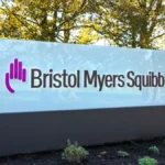 Bristol Myers Squibb headquarters sign outside office campus announcing AI and life sciences expansion initiative.