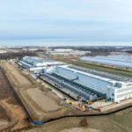 Modern industrial logistics warehouses and technology facilities driving commercial real estate growth worldwide today.