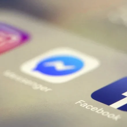 Social media app icons on a smartphone screen representing online platforms facing new safety rules.