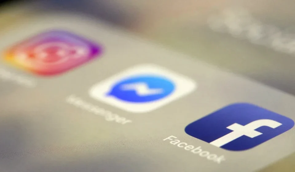 Social media app icons on a smartphone screen representing online platforms facing new safety rules.