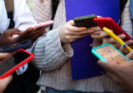 Children using smartphones at school as Europe considers stricter social media age limits for minors.