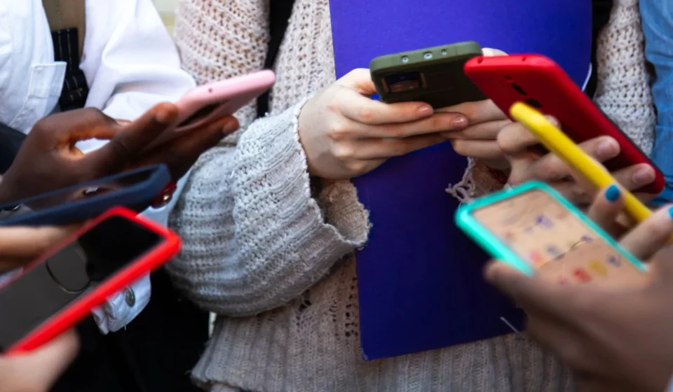 Children using smartphones at school as Europe considers stricter social media age limits for minors.