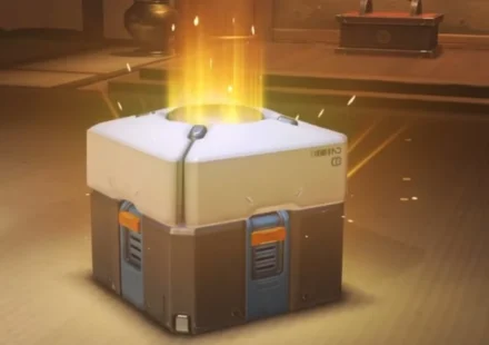 Glowing video game loot box opening with golden light symbolizing digital rewards and microtransactions