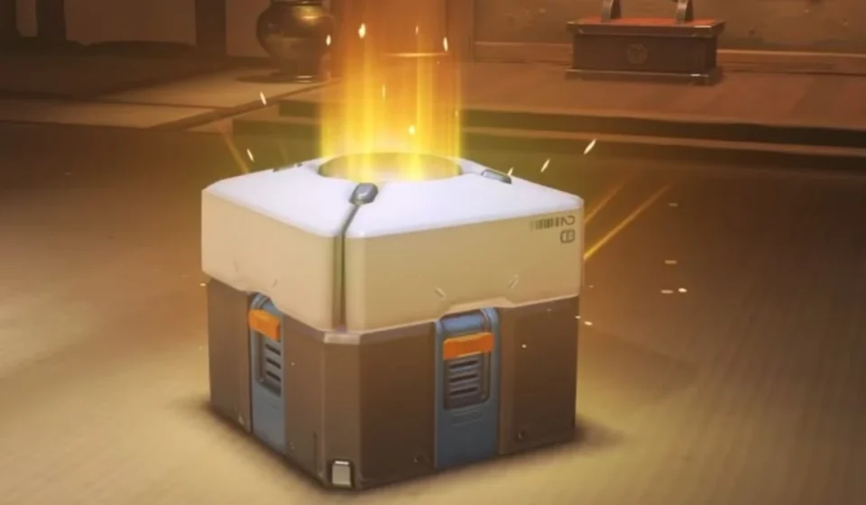 Glowing video game loot box opening with golden light symbolizing digital rewards and microtransactions