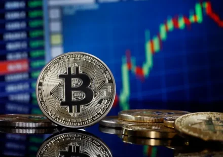 Bitcoin coin displayed before a rising cryptocurrency price chart, reflecting strong market momentum and growth.