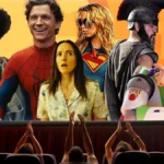 Moviegoers watch a screen featuring popular film characters celebrating the summer box office success.