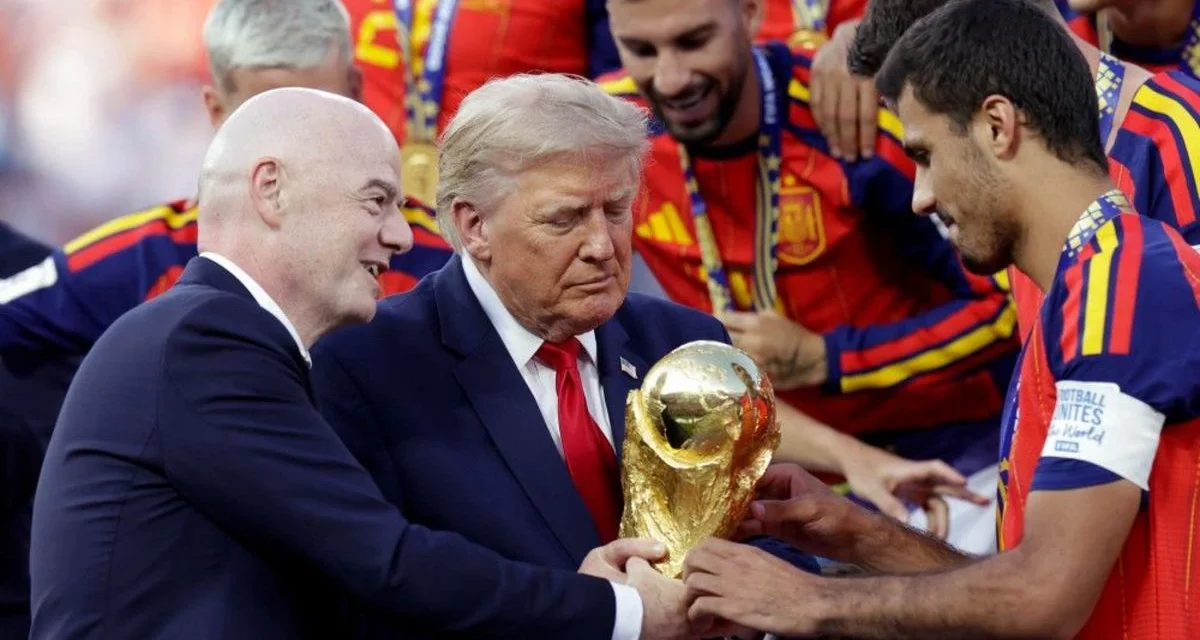 FIFA President Gianni Infantino presents trophy as Spain celebrates title with officials on stage