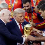 FIFA President Gianni Infantino presents trophy as Spain celebrates title with officials on stage