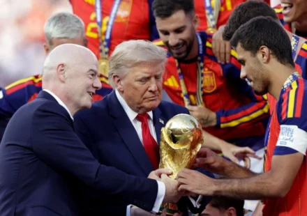 FIFA President Gianni Infantino presents trophy as Spain celebrates title with officials on stage