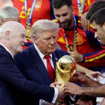 FIFA President Gianni Infantino presents trophy as Spain celebrates title with officials on stage