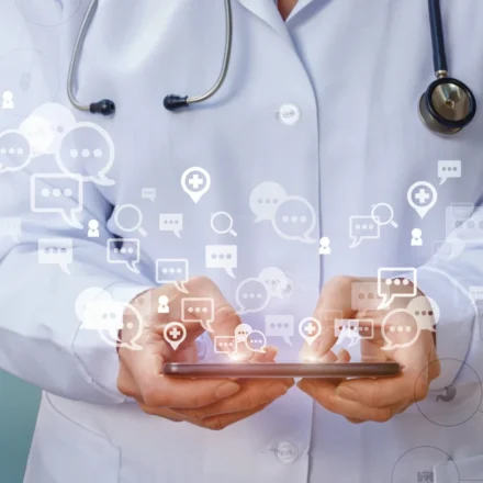 Doctor using a smartphone with digital healthcare icons illustrating online medical communication and AI.