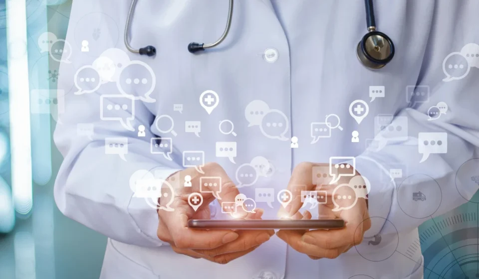 Doctor using a smartphone with digital healthcare icons illustrating online medical communication and AI.