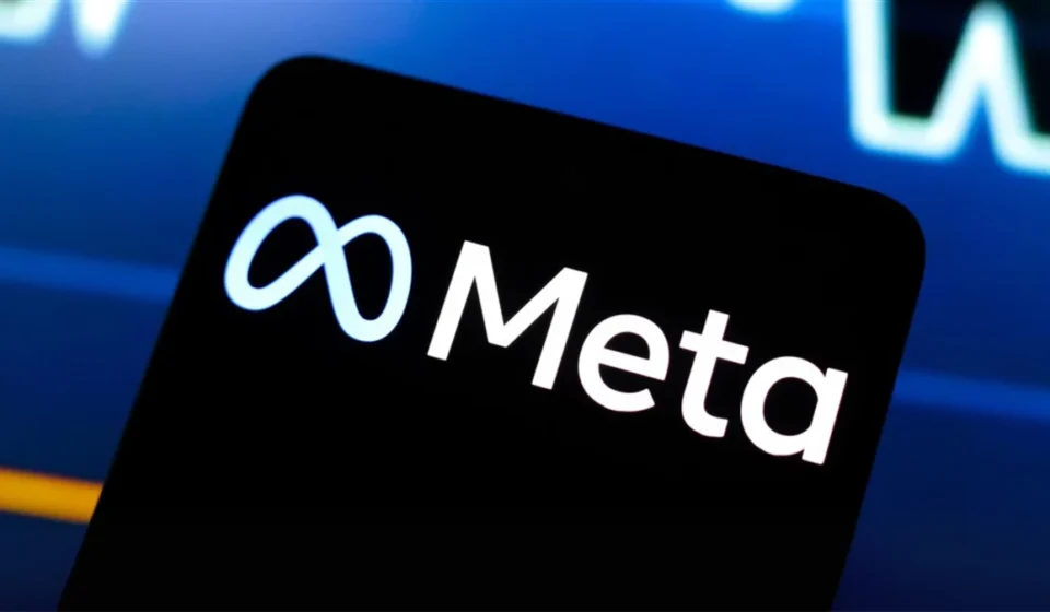 Meta logo displayed on a smartphone screen with a financial market chart, symbolizing AI investment growth.