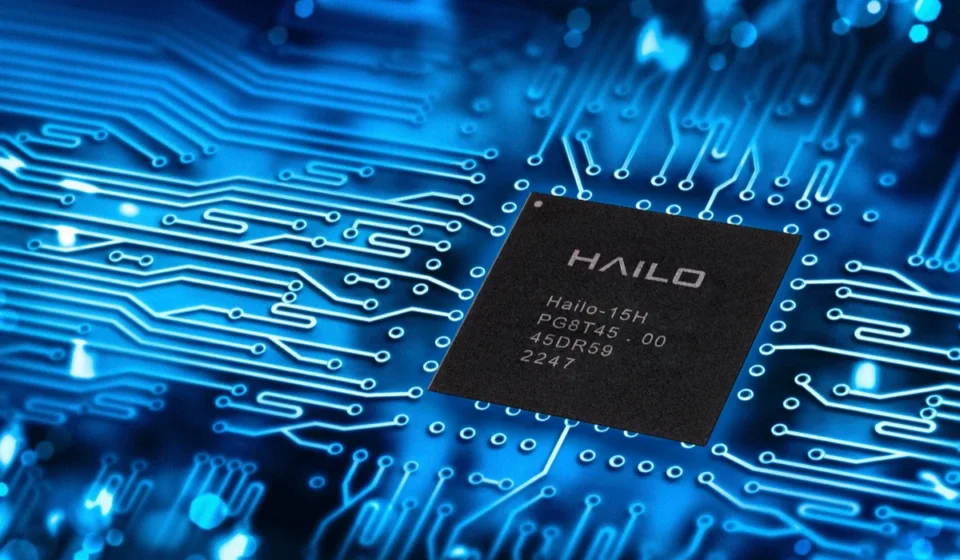 Hailo edge AI processor chip displayed on a blue circuit board representing advanced embedded AI technology.