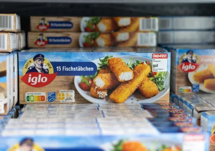 Iglo frozen fish sticks displayed in a supermarket freezer representing Nomad Foods products on sale.