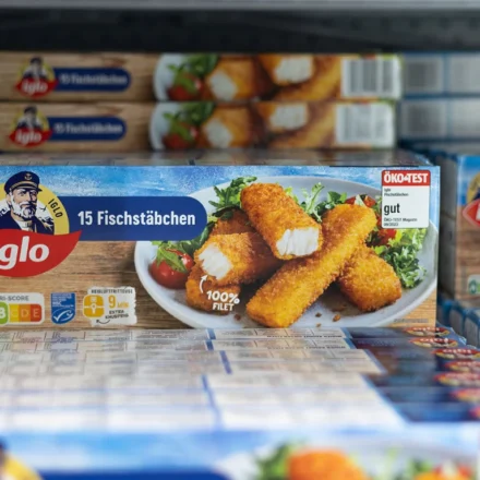 Iglo frozen fish sticks displayed in a supermarket freezer representing Nomad Foods products on sale.