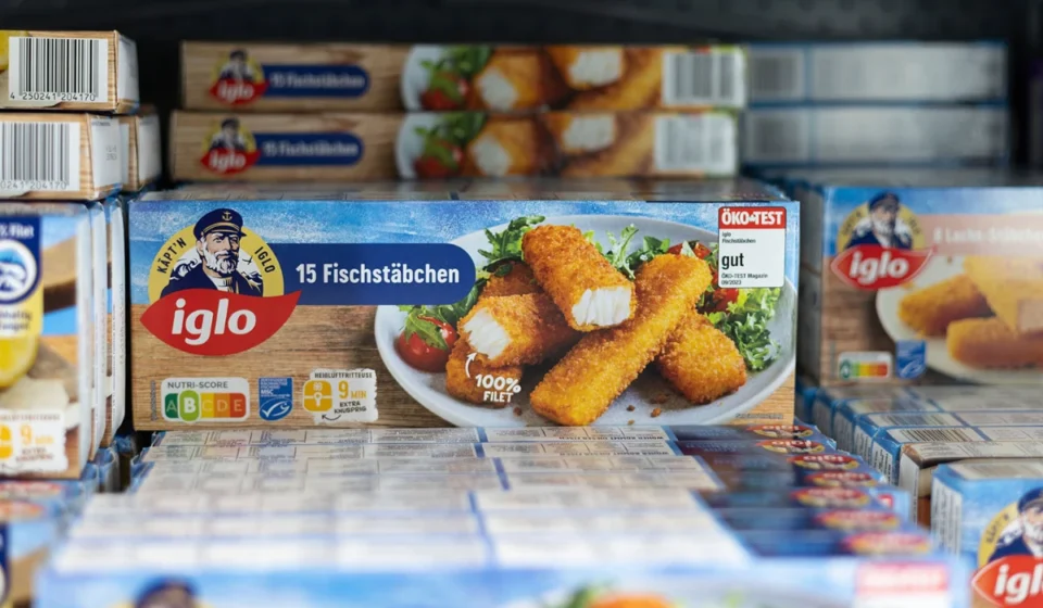 Iglo frozen fish sticks displayed in a supermarket freezer representing Nomad Foods products on sale.