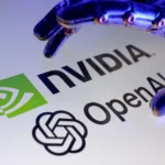 Nvidia and OpenAI logos beneath a robotic hand, symbolizing AI infrastructure investment and growth.