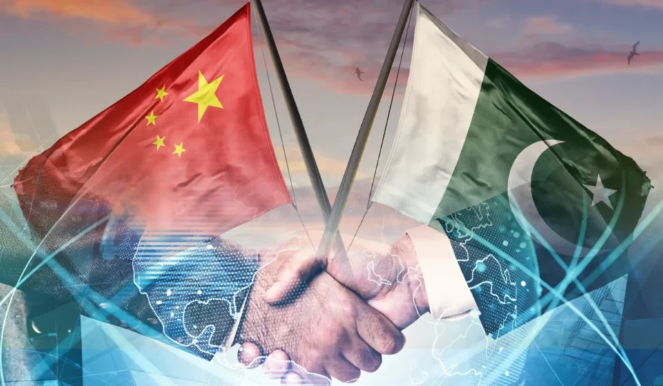 Pakistan and China flags over handshake symbolizing AI alliance and digital cooperation under CPEC 2.0 plan.