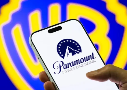 Paramount logo displayed on a smartphone as Warner Bros. merger faces legal review and delay.