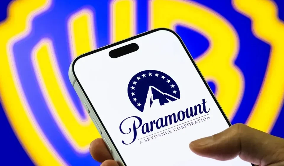 Paramount logo displayed on a smartphone as Warner Bros. merger faces legal review and delay.