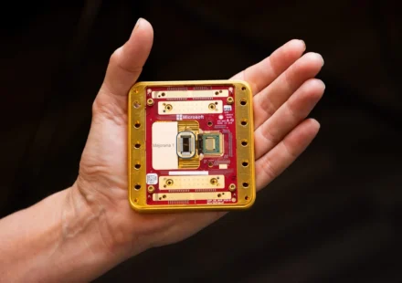 Hand holding a Microsoft quantum computing chip prototype showcasing advanced quantum hardware design.