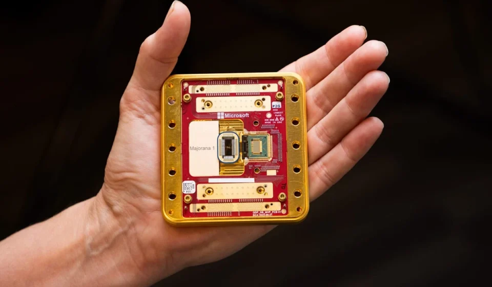 Hand holding a Microsoft quantum computing chip prototype showcasing advanced quantum hardware design.