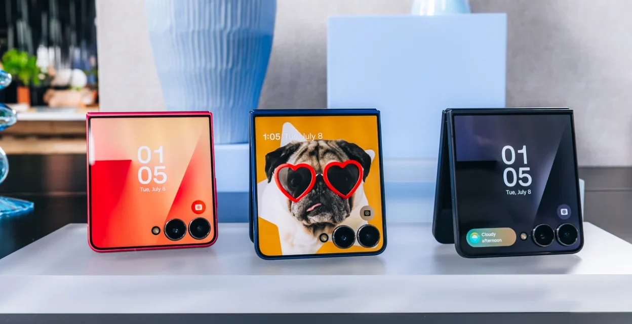 Samsung Galaxy Z Flip foldable smartphones displayed with colorful cover screens before product launch event.