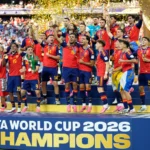 Spain players celebrate lifting the FIFA World Cup 2026 trophy after a 1 to 0 victory over Argentina.