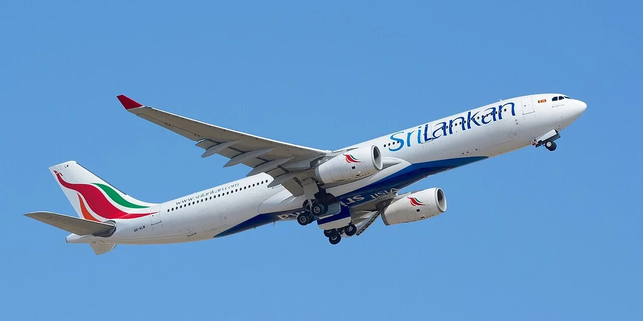SriLankan Airlines jet takes off against a clear blue sky for Maldives regional connections.