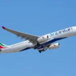 SriLankan Airlines jet takes off against a clear blue sky for Maldives regional connections.