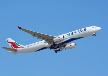 SriLankan Airlines jet takes off against a clear blue sky for Maldives regional connections.