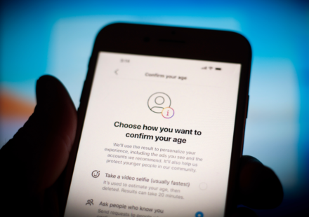 Smartphone displaying an age verification screen with privacy focused identity confirmation options online.