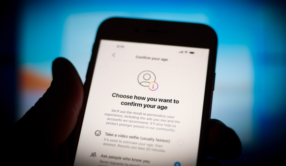 Smartphone displaying an age verification screen with privacy focused identity confirmation options online.