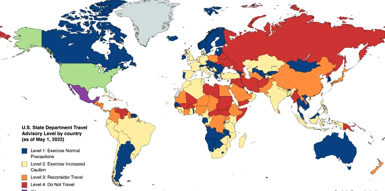World map showing U.S. State Department travel advisory levels across countries by security risk status.
