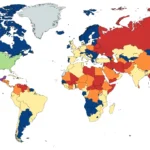 World map showing U.S. State Department travel advisory levels across countries by security risk status.