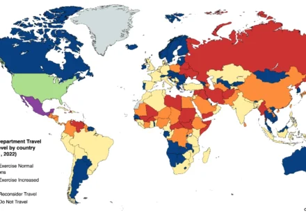 World map showing U.S. State Department travel advisory levels across countries by security risk status.