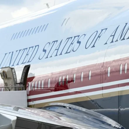 US president waves beside Air Force One before departure amid heightened security during overseas trip