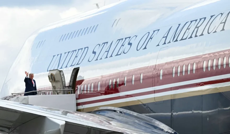 US president waves beside Air Force One before departure amid heightened security during overseas trip