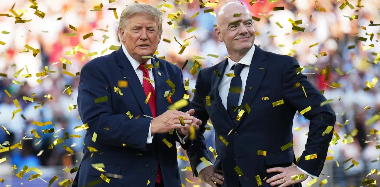 Donald Trump and FIFA president stand amid gold confetti during a World Cup stadium ceremony celebration