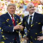 Donald Trump and FIFA president stand amid gold confetti during a World Cup stadium ceremony celebration
