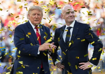 Donald Trump and FIFA president stand amid gold confetti during a World Cup stadium ceremony celebration