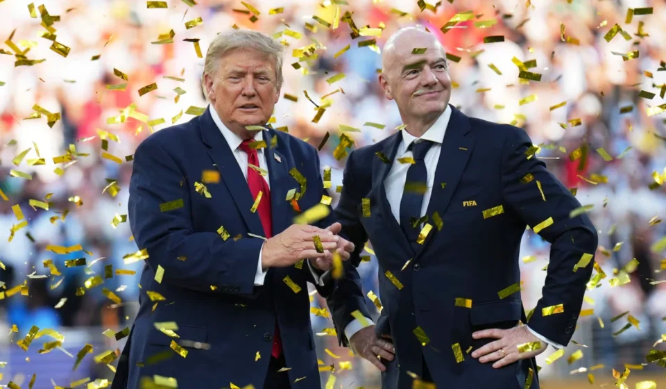 Donald Trump and FIFA president stand amid gold confetti during a World Cup stadium ceremony celebration